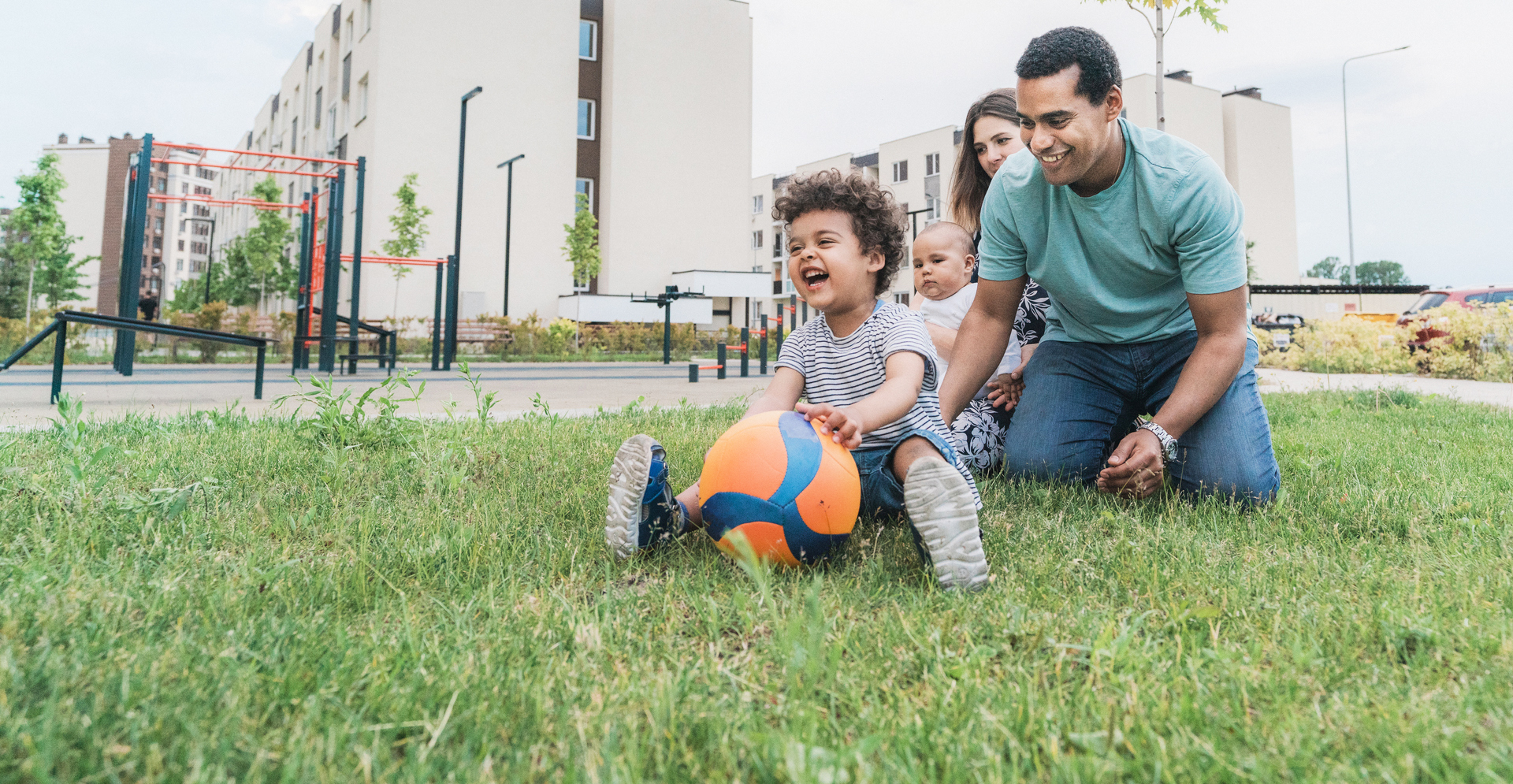 Happy family playing in a park