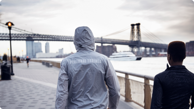 Personal trainer walking in New York Bridge